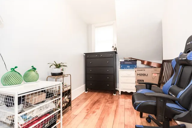 a living room with furniture and lamp