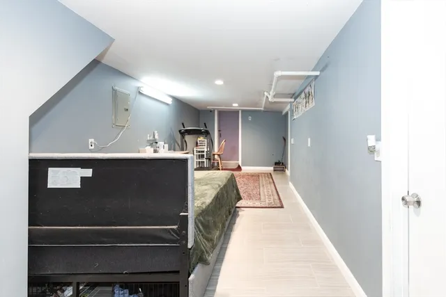 a view of kitchen with a refrigerator and a fireplace