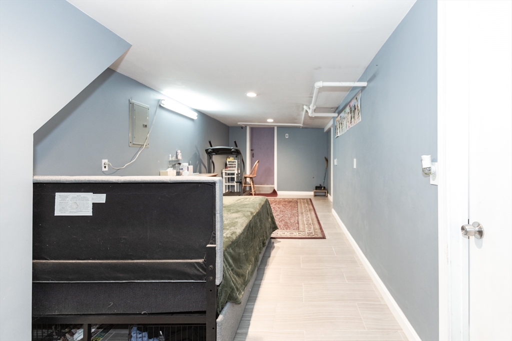 68 Spring Street Holbrook, MA 02343 - Photo 19 of 21 a view of kitchen with a refrigerator and a fireplace