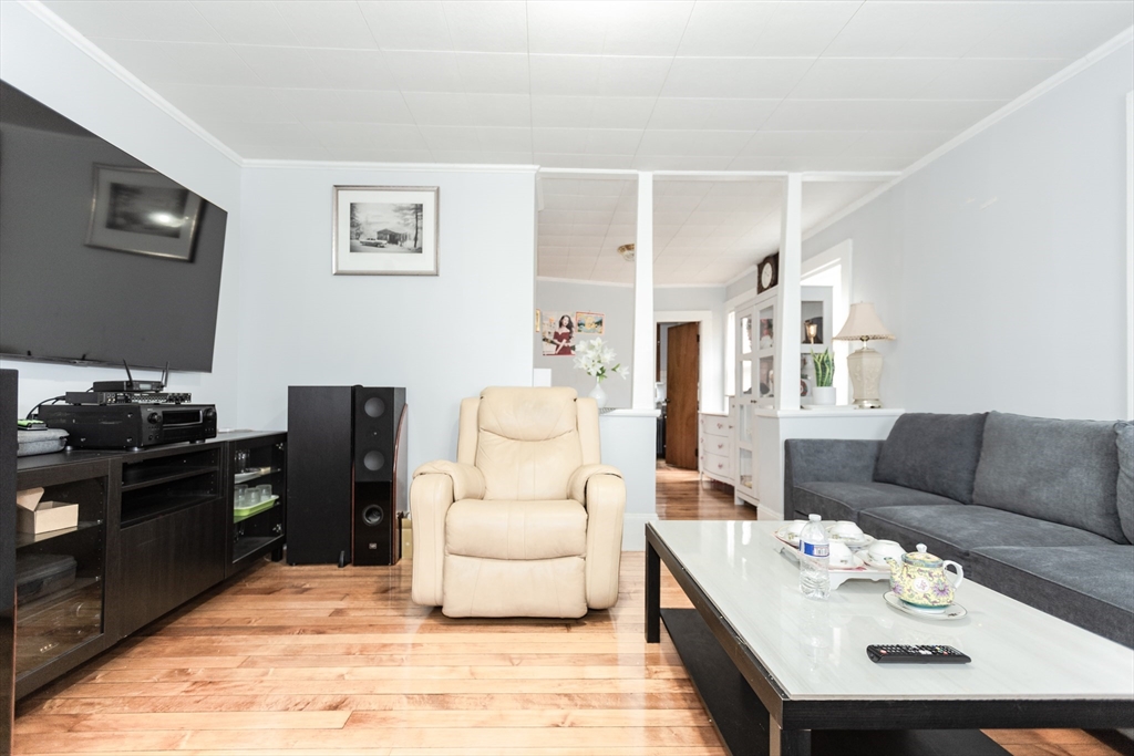 68 Spring Street Holbrook, MA 02343 - Photo 2 of 21 a living room with furniture and a wooden floor