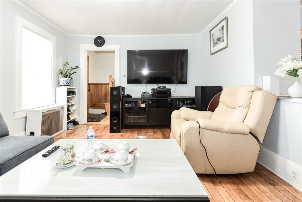 68 Spring Street Holbrook, MA 02343 - Photo 4 of 21 a living room with furniture and a flat screen tv