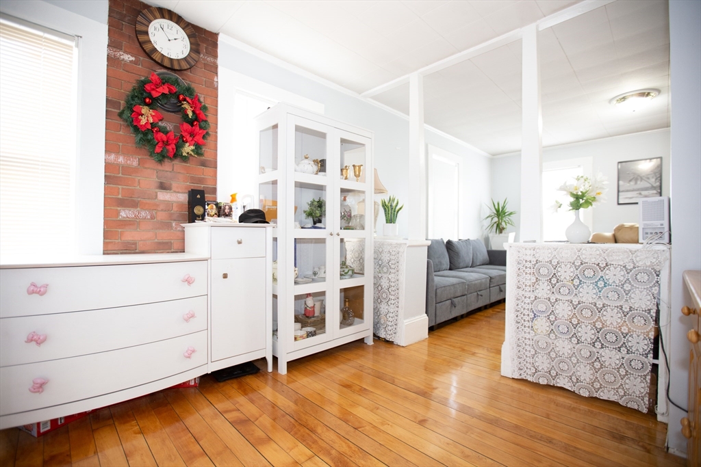 68 Spring Street Holbrook, MA 02343 - Photo 7 of 21 a living room with furniture and wooden floor