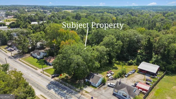 an aerial view of a house with a garden