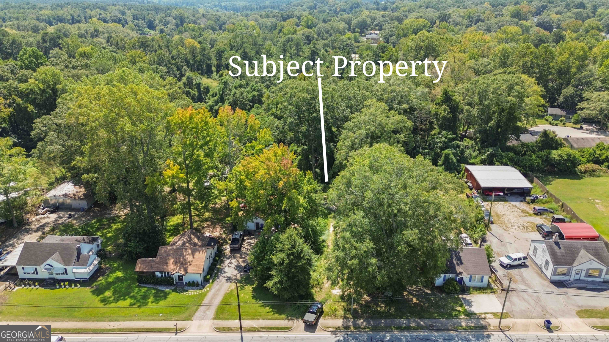 108 West May Street Winder, GA 30680 - Photo 4 of 9 a sign that is sitting on a brick wall