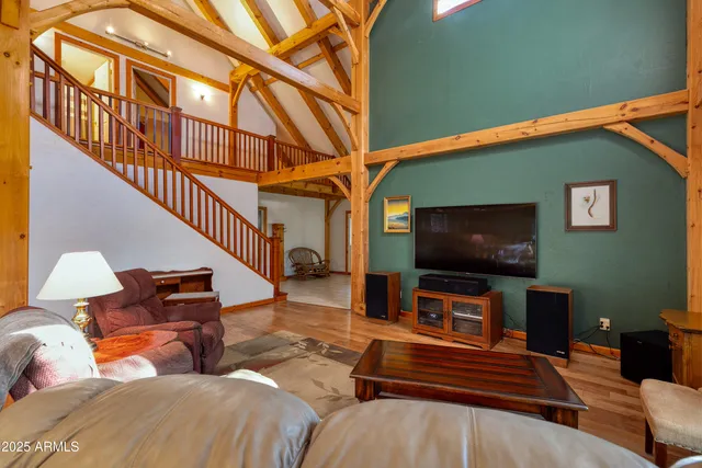 a living room with furniture or wooden floor and a table