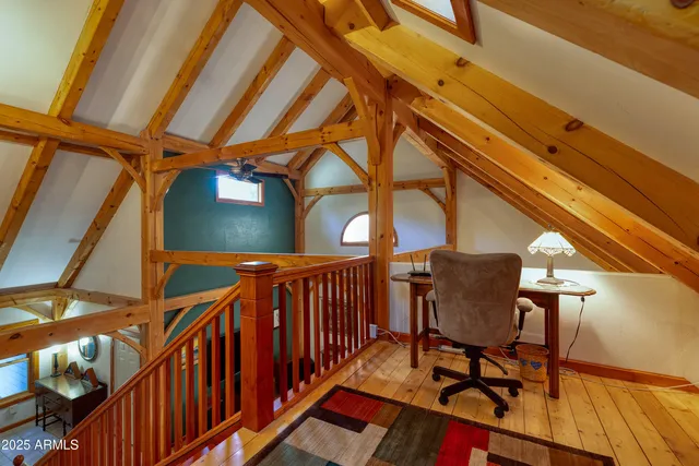 a view of deck with wooden floor and door