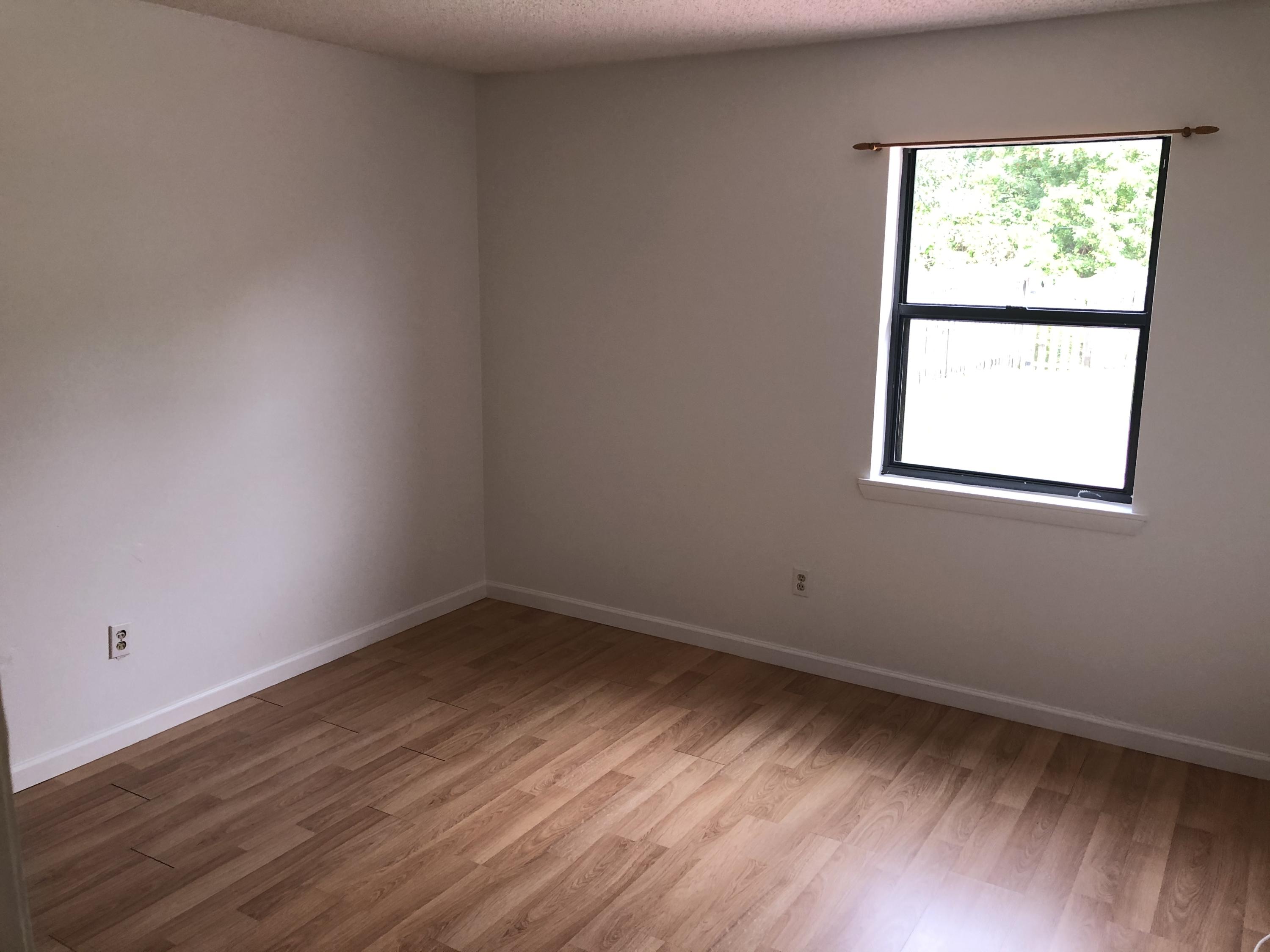 4063 Southeast Jacaranda Street Stuart, FL 34997 - Photo 14 of 15 an empty room with a window