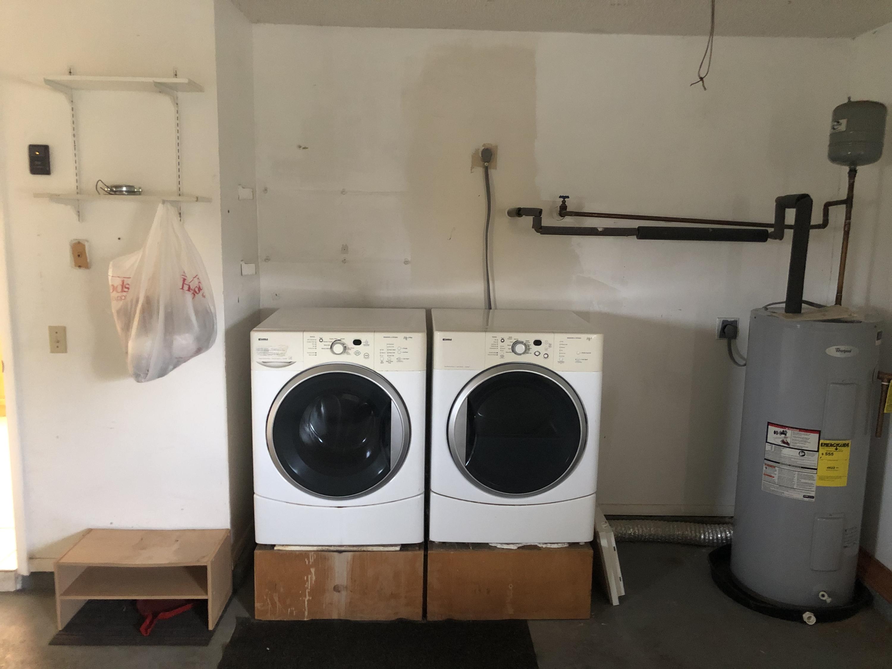 4063 Southeast Jacaranda Street Stuart, FL 34997 - Photo 15 of 15 a utility room with dryer and washer