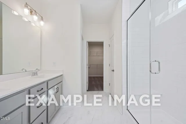 a bathroom with a sink and mirror