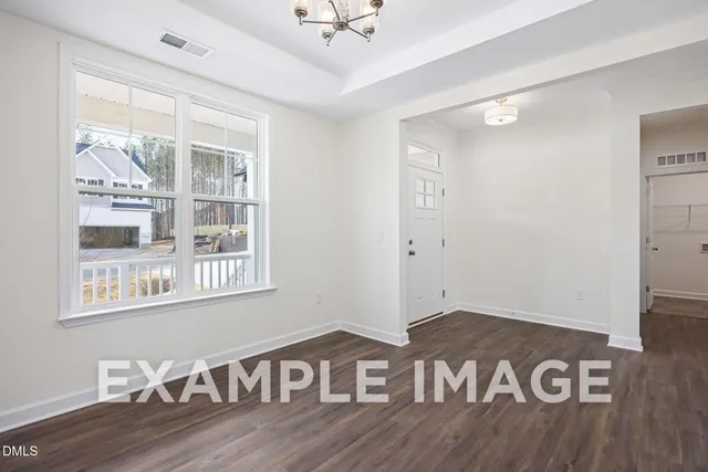 a view of a livingroom with wooden floor