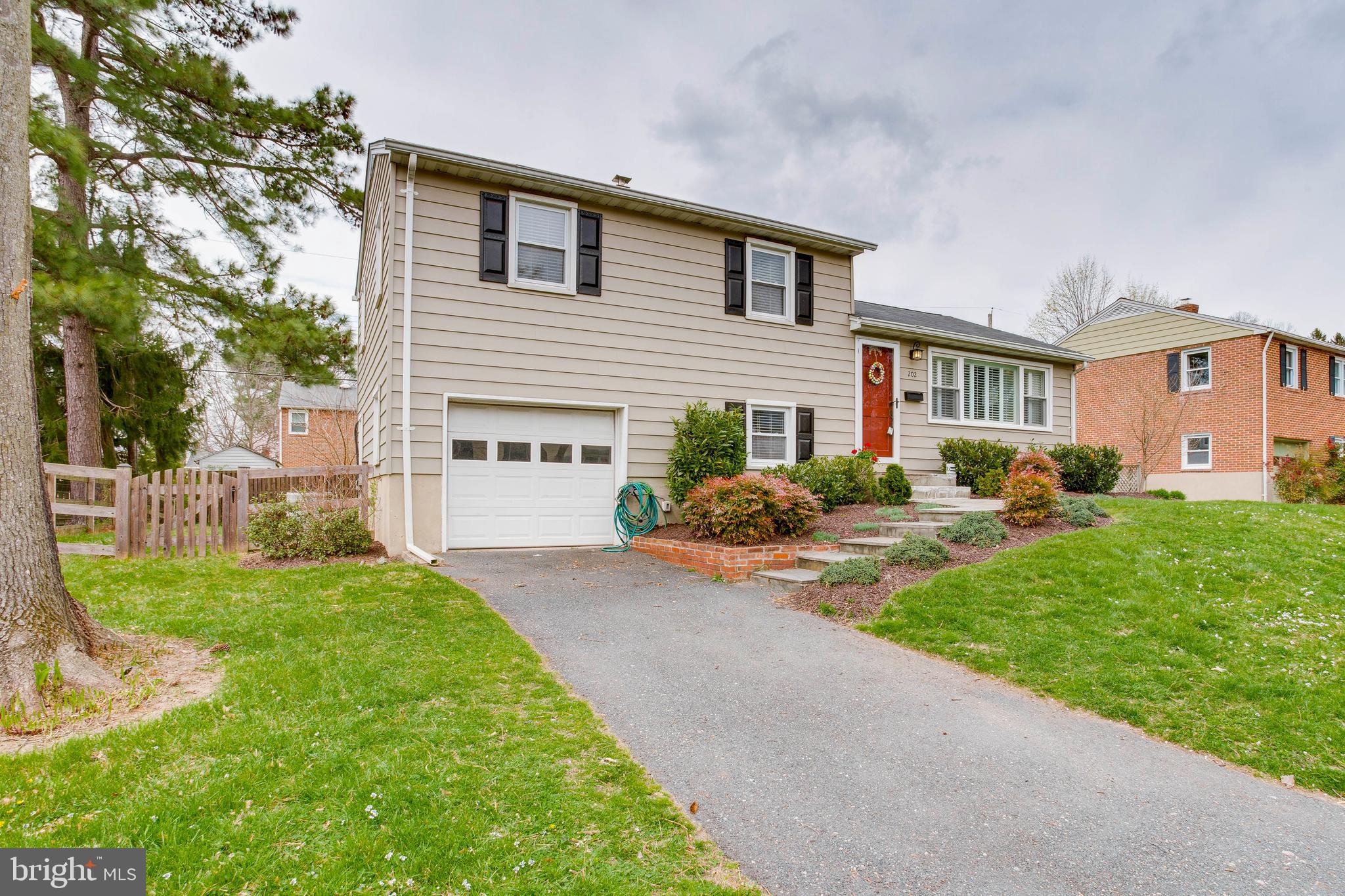 202 Rollingdale Road Baltimore, MD 21228 - Photo 2 of 47 Driveway + garage for easy parking