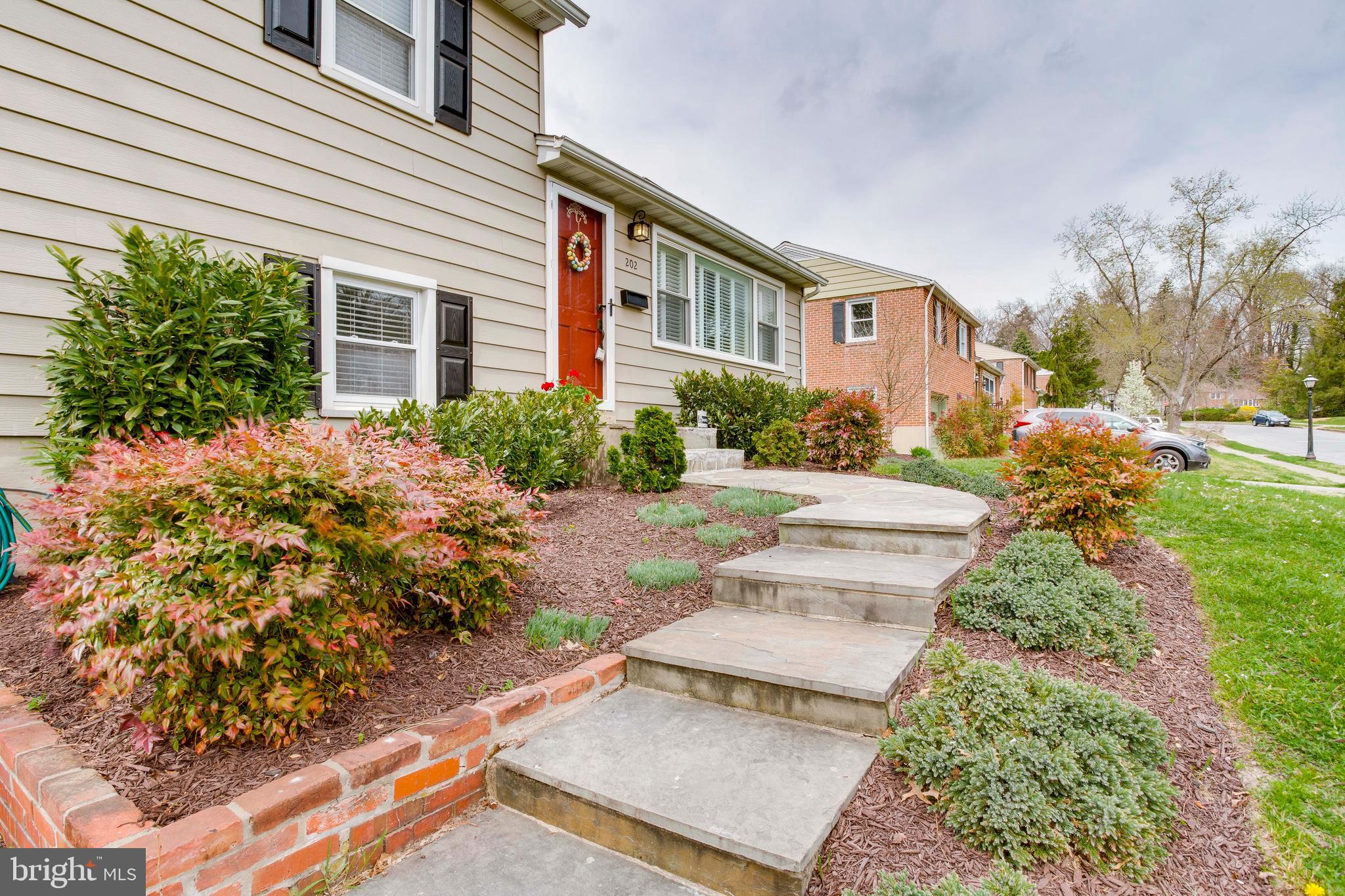 202 Rollingdale Road Baltimore, MD 21228 - Photo 3 of 47 Stone walkway surrounded by lovely landscaping