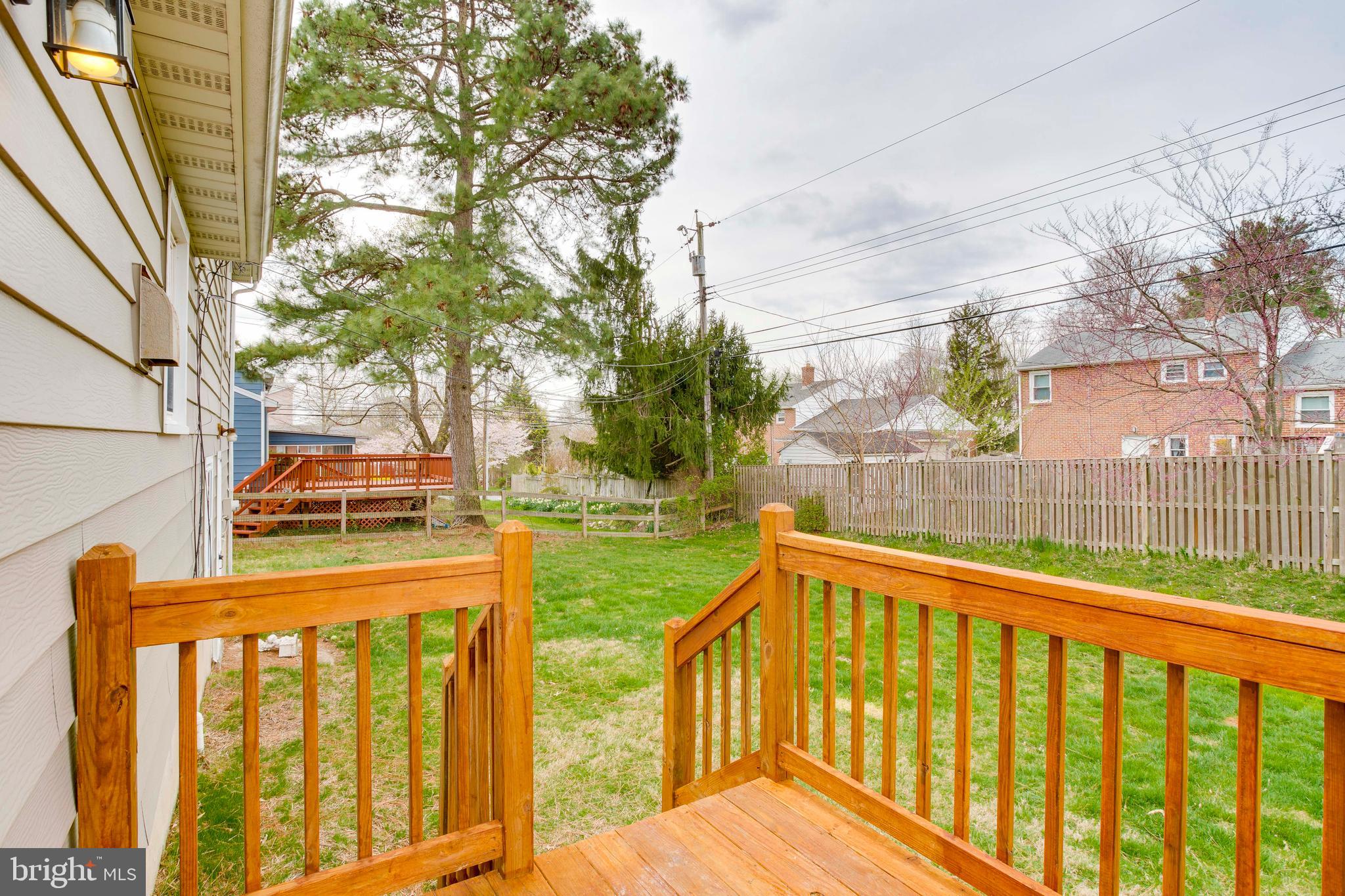 202 Rollingdale Road Baltimore, MD 21228 - Photo 4 of 47 Deck off Dining room leads to fenced yard