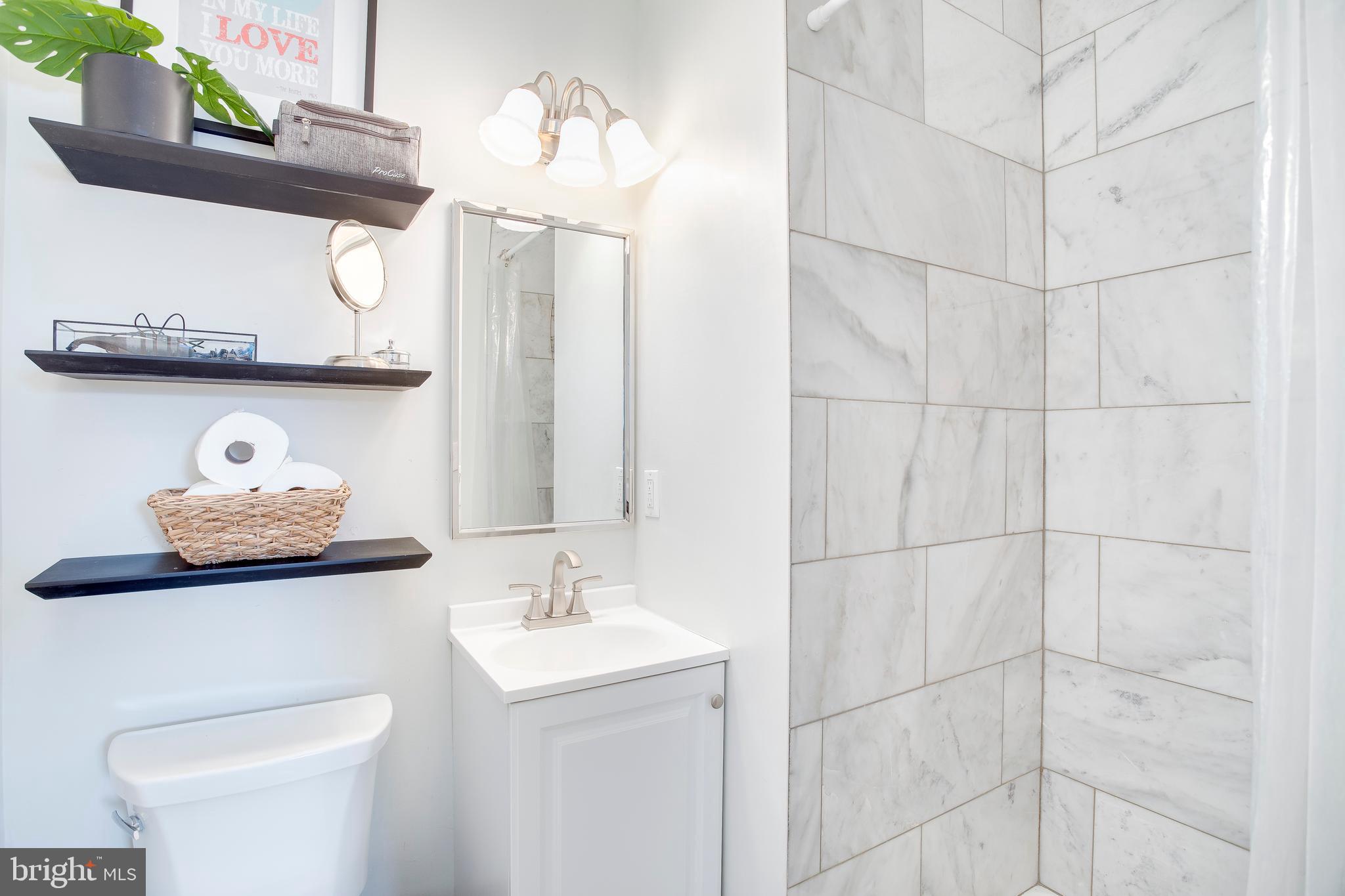 202 Rollingdale Road Baltimore, MD 21228 - Photo 36 of 47 FABULOUS MBR bath-herring bone fl.& Marble shower