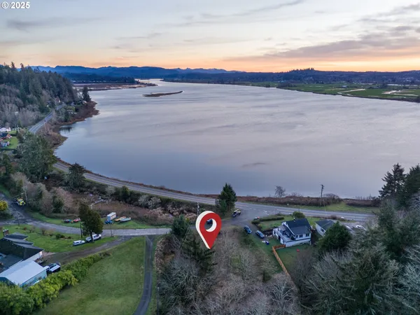 an aerial view of a house with mountain view