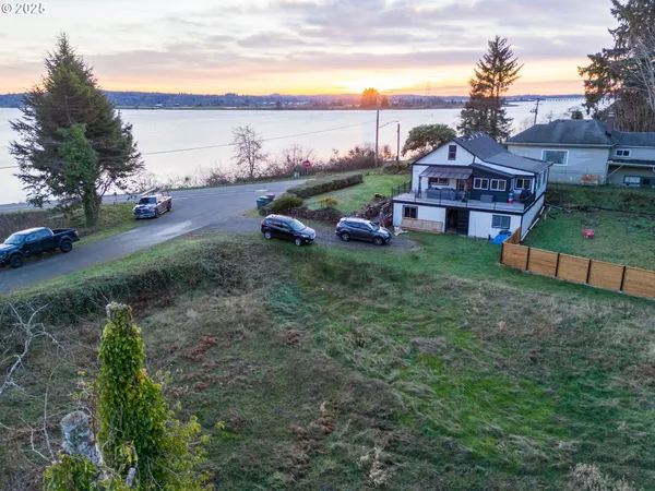 a view of houses with outdoor space and lakeside