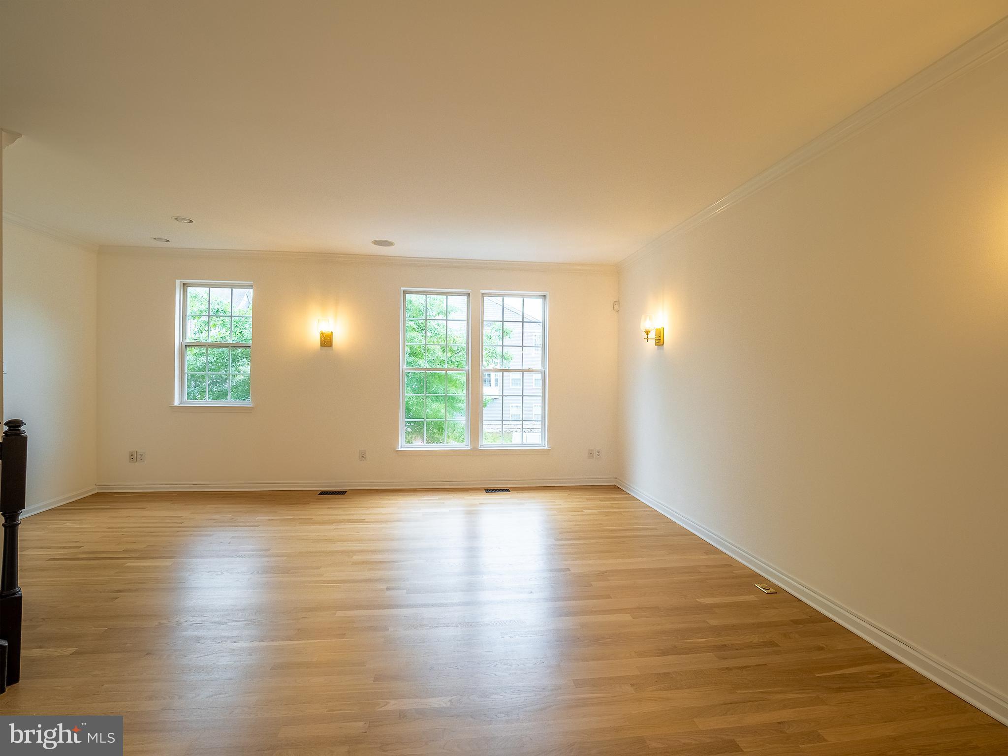 70 River Lane Delanco, NJ 08075 - Photo 17 of 35 an empty room with wooden floor and windows