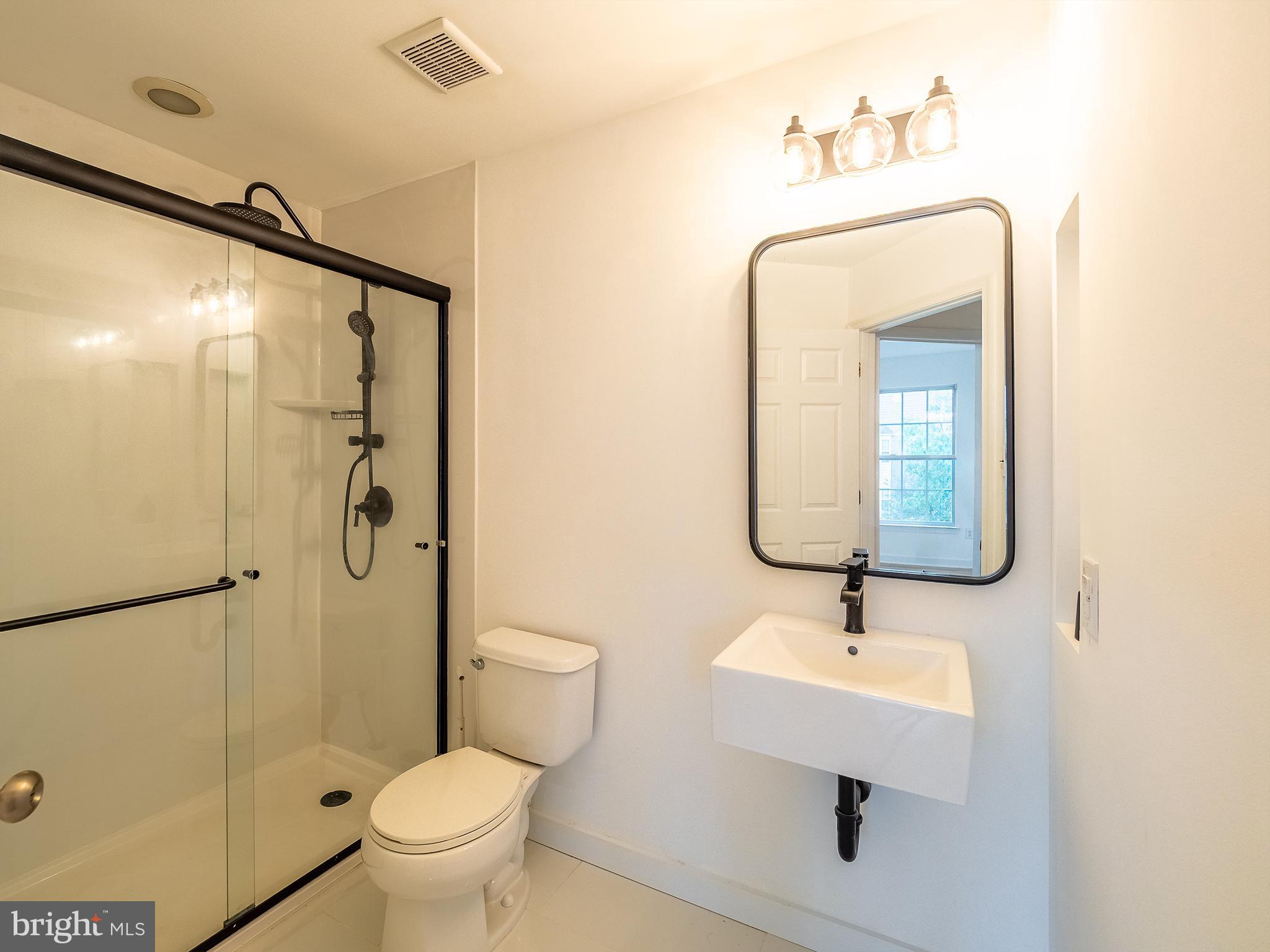 70 River Lane Delanco, NJ 08075 - Photo 24 of 35 a bathroom with a toilet sink and shower