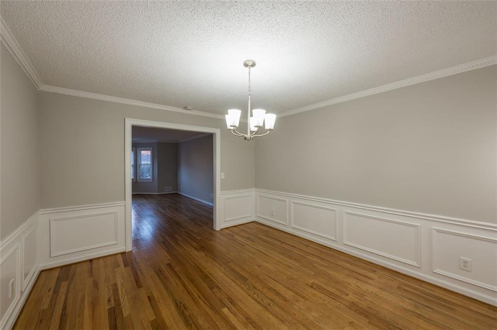 4648 Calumet Circle Northwest Duluth, GA 30096 - Photo 11 of 37 wooden floor in an empty room with a window