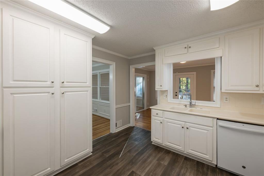 4648 Calumet Circle Northwest Duluth, GA 30096 - Photo 14 of 37 a bathroom with a sink a mirror and a shower