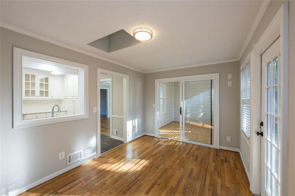 4648 Calumet Circle Northwest Duluth, GA 30096 - Photo 19 of 37 a view of empty room with wooden floor and fan