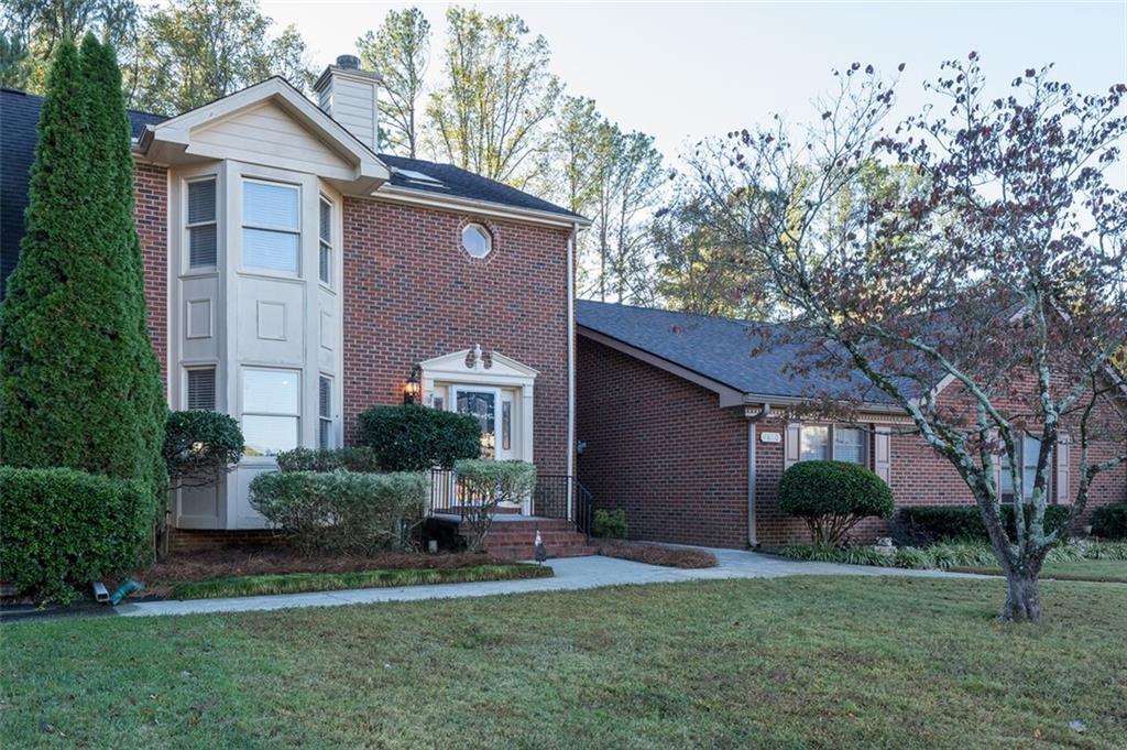 4648 Calumet Circle Northwest Duluth, GA 30096 - Photo 2 of 37 front view of a house with a yard