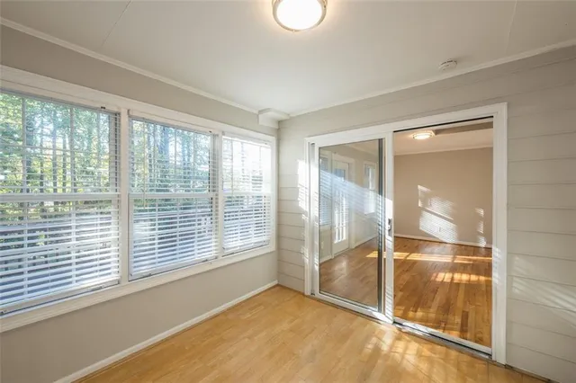 a view of an empty room with a window
