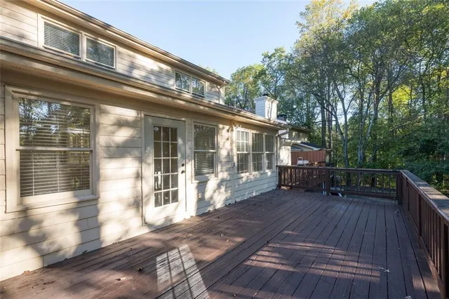 a view of a house with backyard porch and sitting area
