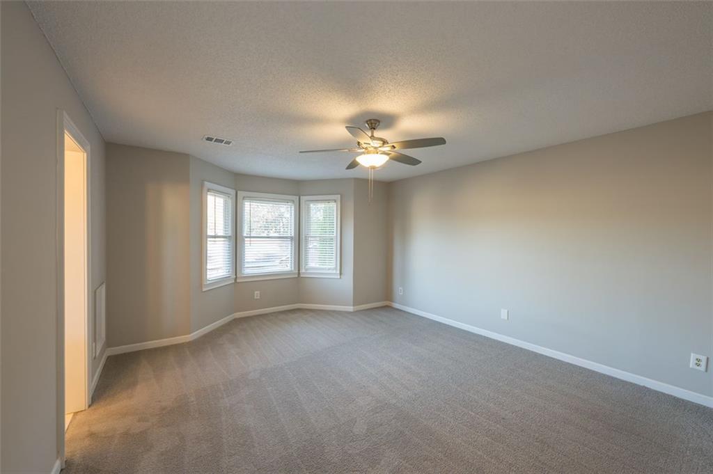 4648 Calumet Circle Northwest Duluth, GA 30096 - Photo 25 of 37 a view of an empty room with a window