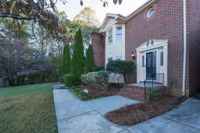 a front view of a house with garden
