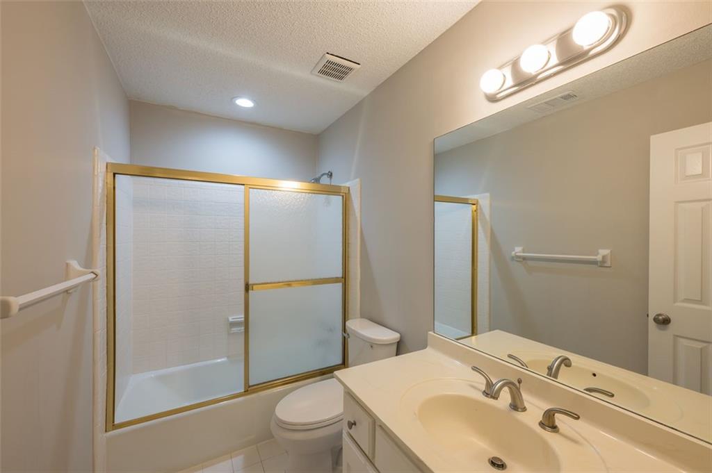 4648 Calumet Circle Northwest Duluth, GA 30096 - Photo 33 of 37 a bathroom with a sink toilet and shower