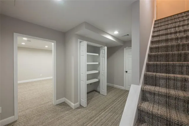 a view of an empty room and wooden floor