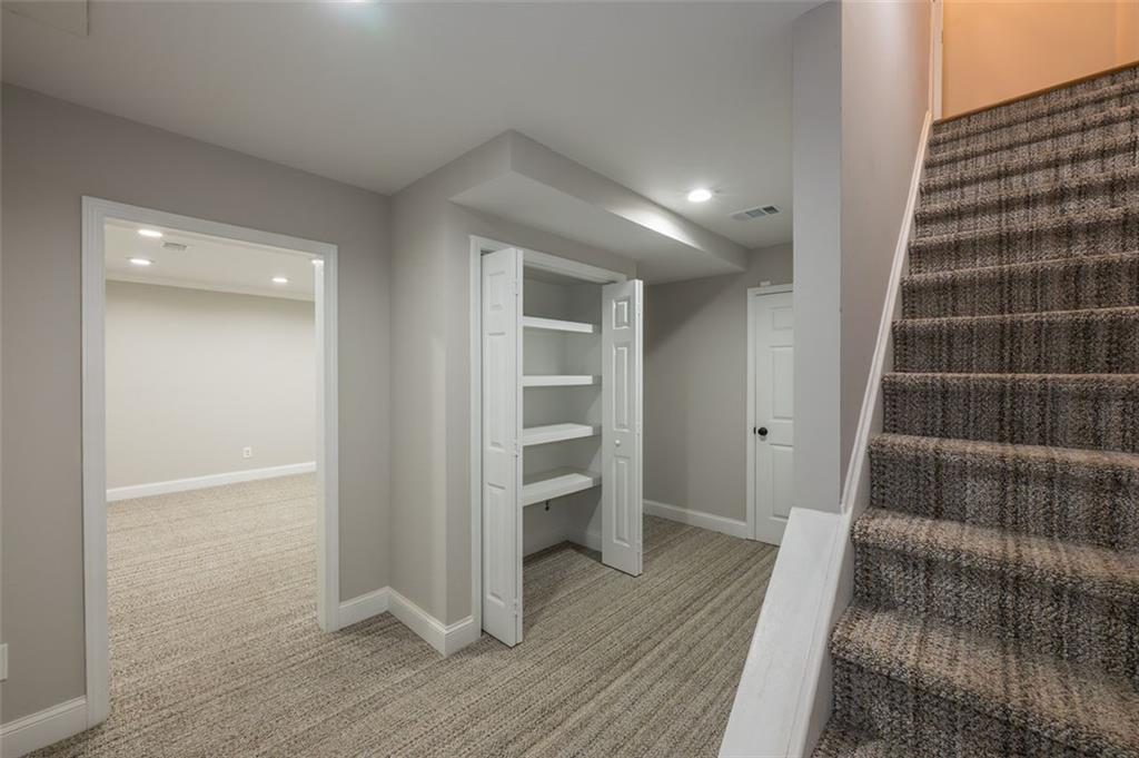 4648 Calumet Circle Northwest Duluth, GA 30096 - Photo 36 of 37 a view of an empty room and wooden floor
