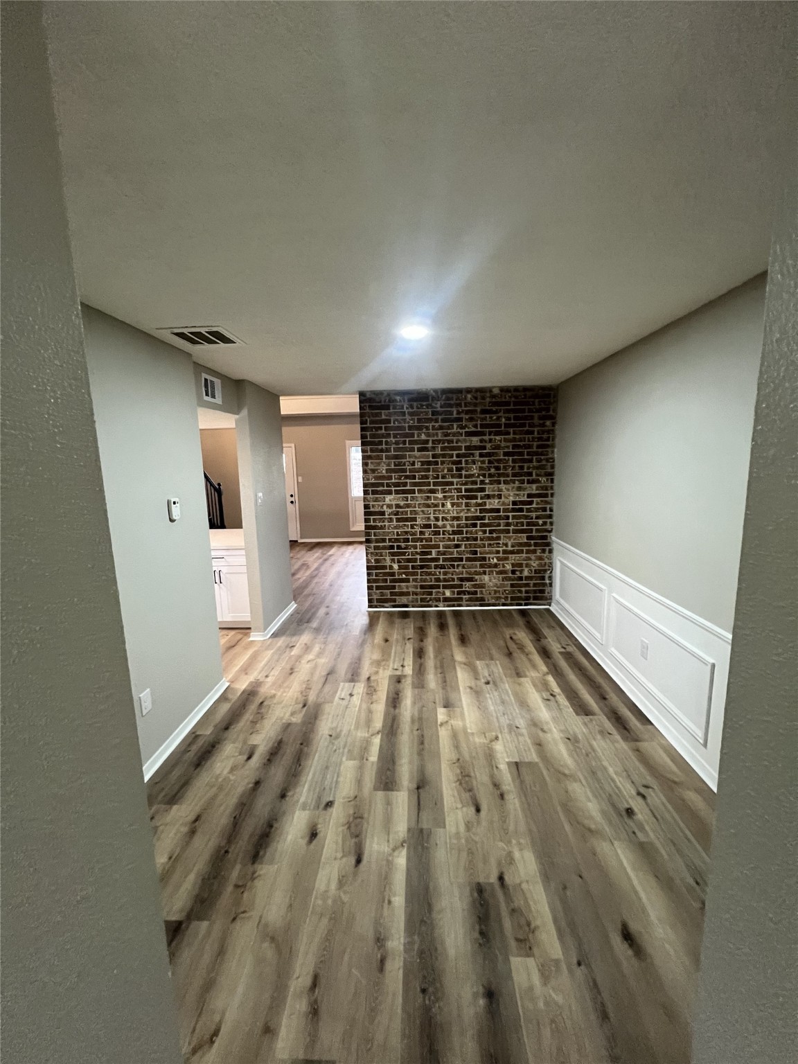 1310 Town Circle, Unit 1 Baytown, TX 77520 - Photo 12 of 21 a view of empty room with wooden floor