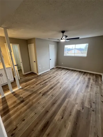 a view of empty room with windows