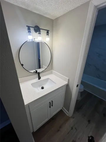 a bathroom with a sink and mirror