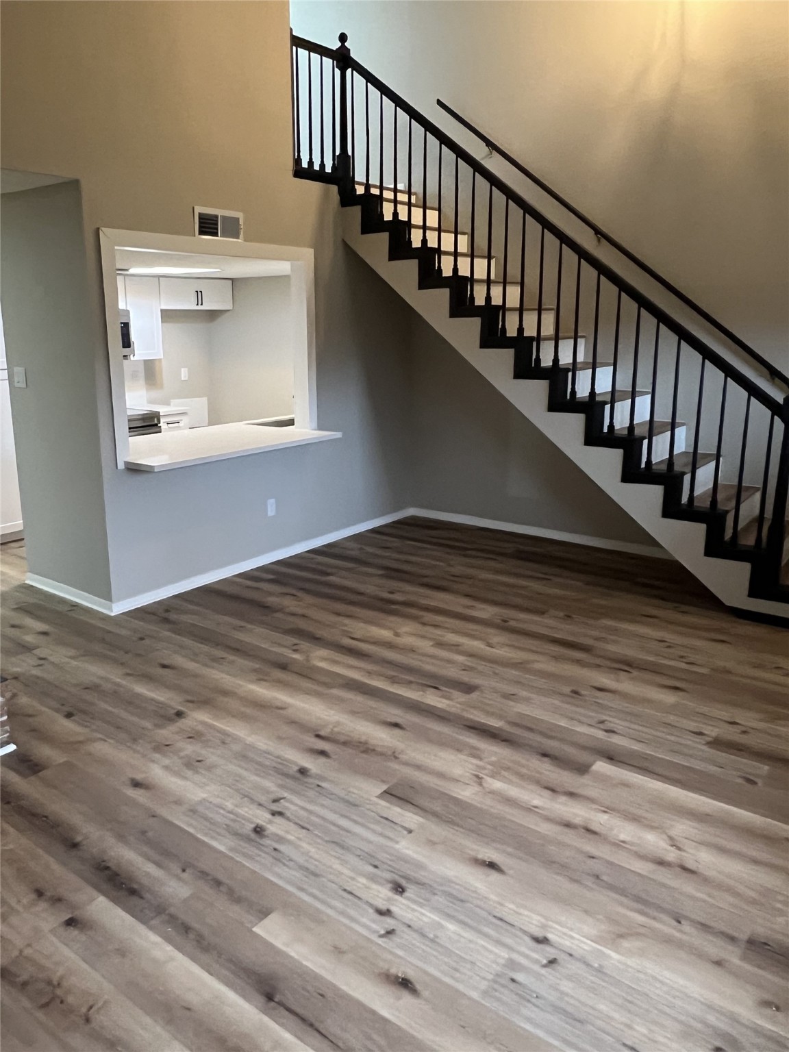1310 Town Circle, Unit 1 Baytown, TX 77520 - Photo 2 of 21 a view of entryway and hall with wooden floor
