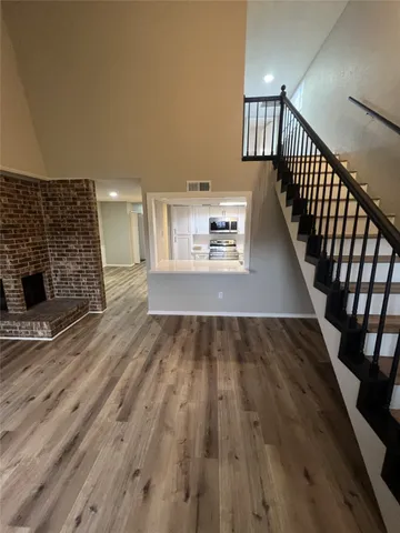 a view of a livingroom with wooden floor