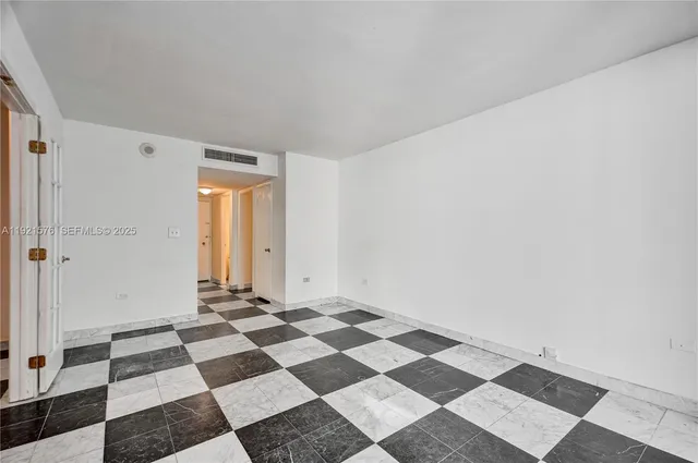 a view of a black and white checkered floor with a black white checkered floor