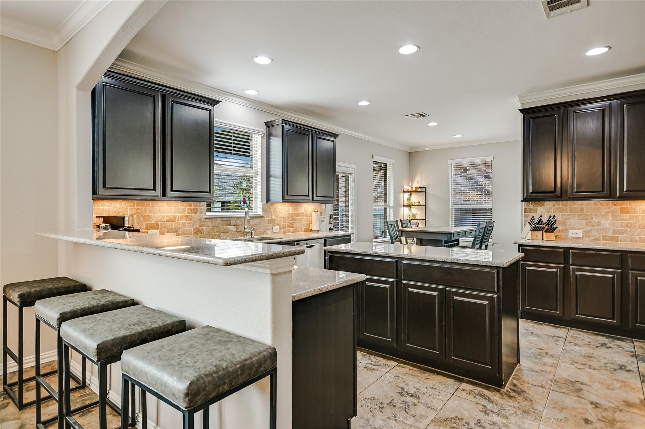 4623 Chestnut Meadows Bend Georgetown, TX 78626 - Photo 12 of 30 a kitchen with stainless steel appliances granite countertop a sink stove and refrigerator
