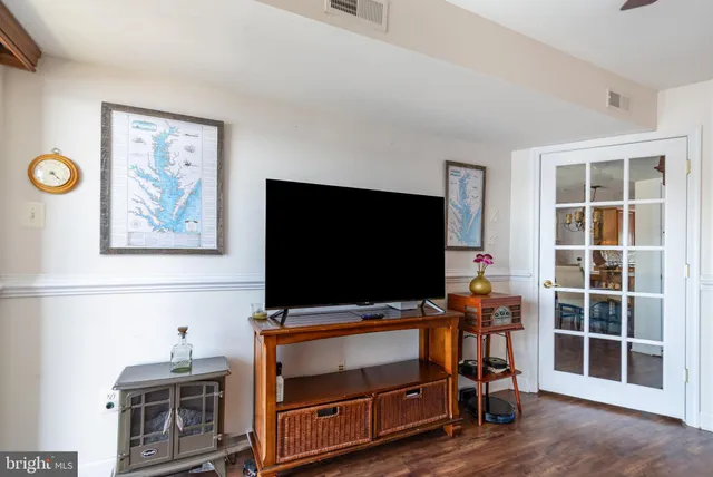 a room with furniture and flat screen tv