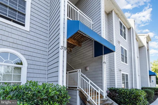 a view of a house with brick walls