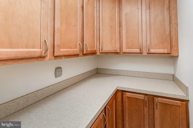 a view of a storage and utility room with a window