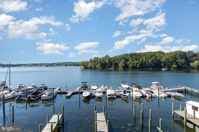 a view of a lake with outdoor seating space