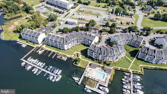 a picture of outdoor space with seating area and car parked