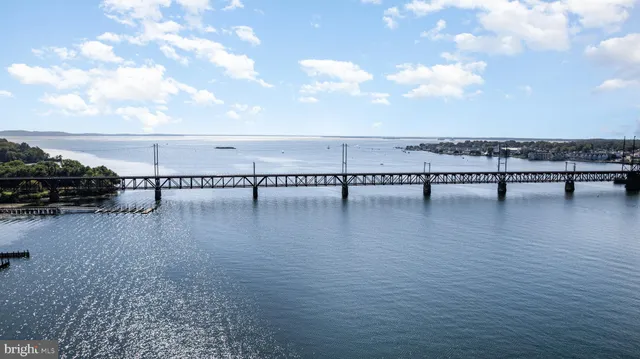 a view of a lake with houses in the background