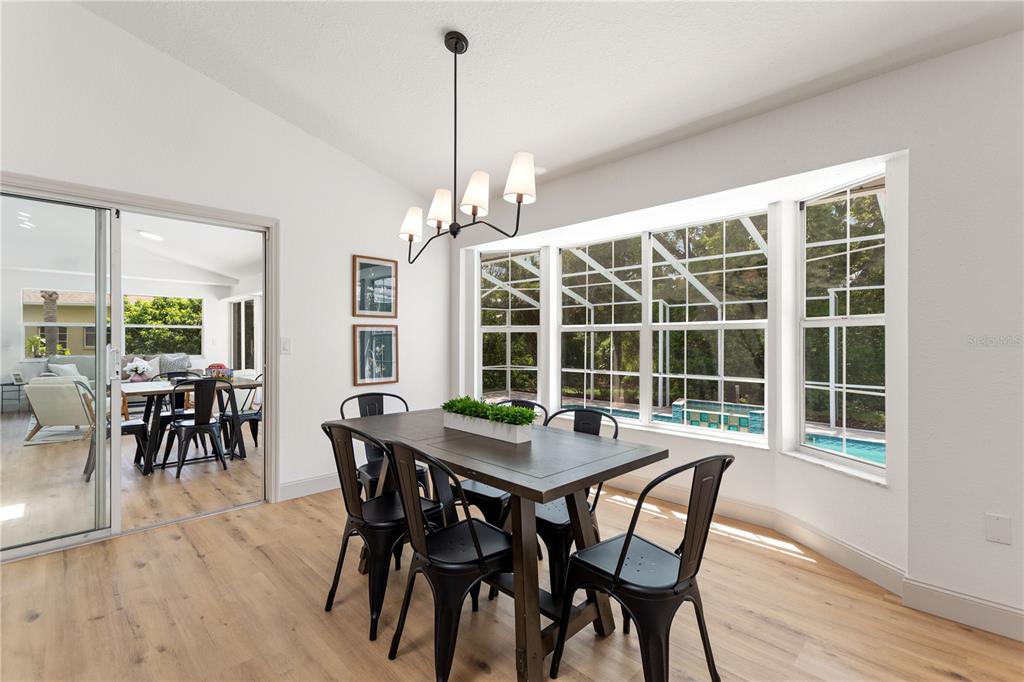 419 Silas Court Spring Hill, FL 34609 - Photo 19 of 56 a view of a dining room with furniture window and outside view