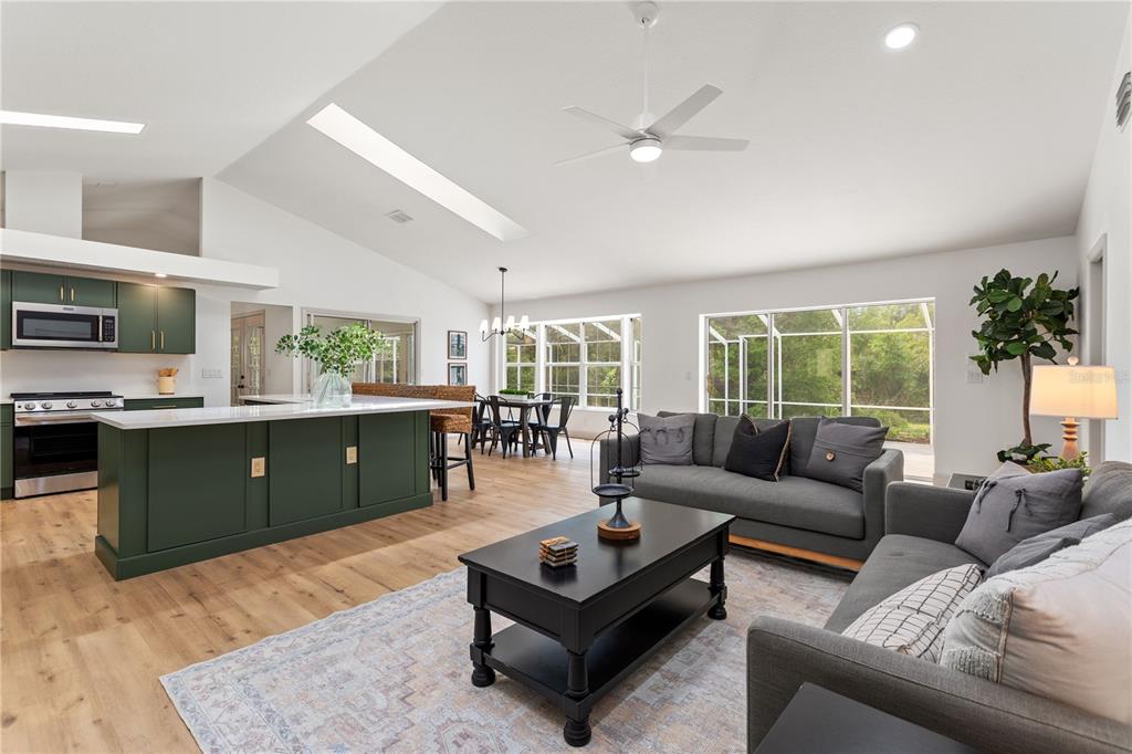 419 Silas Court Spring Hill, FL 34609 - Photo 21 of 56 a living room with furniture and a large window
