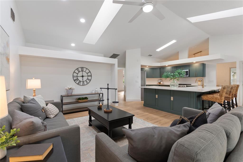 419 Silas Court Spring Hill, FL 34609 - Photo 22 of 56 a living room with furniture kitchen view and a window