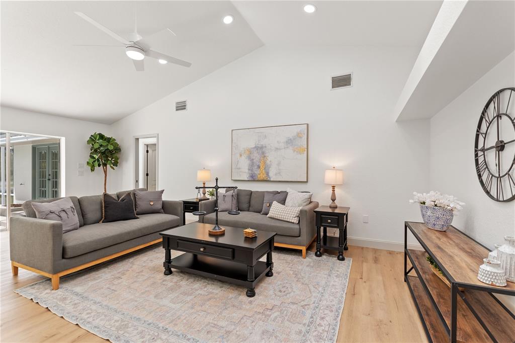 419 Silas Court Spring Hill, FL 34609 - Photo 24 of 56 a living room with furniture and wooden floor